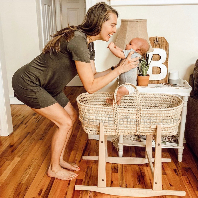 Mom and newborn with Palm Leaf Moses Basket and Rocking Stand - BAB.BET800.jpg